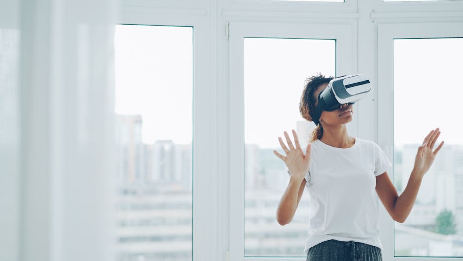 A woman enjoying a virtual reality experience with VR headset indoors.